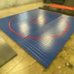 AK Athletic Equipment CLEARANCE 14' X 14' X 1 3/8" Roll Up Wrestling Mat - BLUE WITH RED CIRCLES